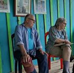 Scott, Jean and Pablo looking at pictures